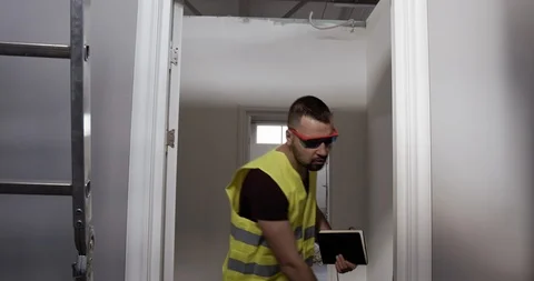 A worker on the construction site. Inspector checks the quality. Video stock 127031954