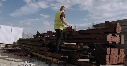 A worker on the construction site. Inspector checks the quality. Stock Footage 127121448