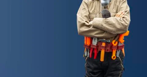 Worker with construction tools on blue background, labor day concept Stock Photos