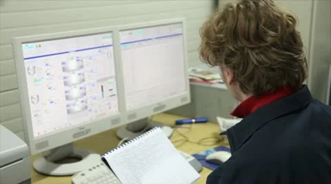 The worker in a control room at the factory Stock Footage 24659585