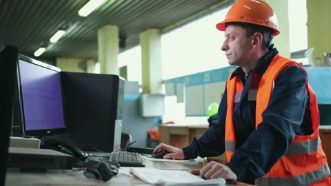 Worker in control room. Heavy industry engineer stand in manufacturing factory Stock-Footage 145811717