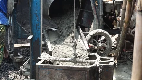Worker controlled concrete mixer machine Stock Footage 273931369