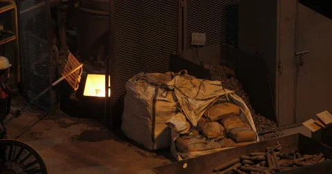 Worker Controlling Iron Smelting  (4K) Stock Footage 63045063