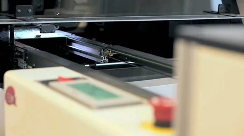 Worker controlling quality of PCB boards on production line in factory Stock Footage 50304181