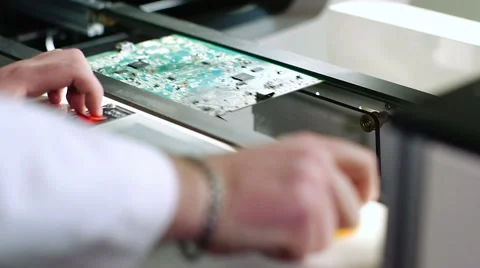 Worker controlling quality of PCB boards on production line in factory Stock Footage 50304735