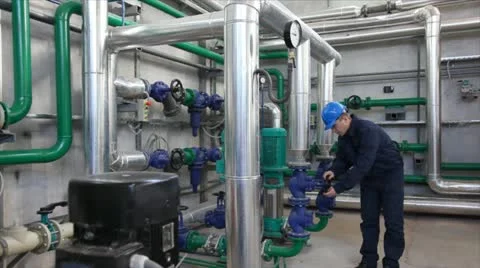 Worker controls devices in a Heating Plant Stock Footage 24651668