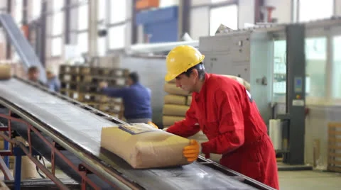 Worker controls sacks of sugar in Warehouse Stock Footage 27166665