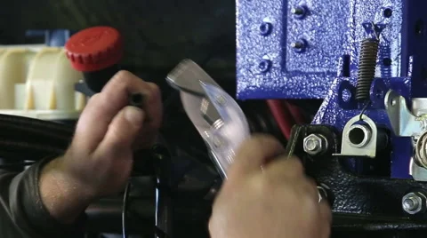 Worker contructing engine on automobile factory Stock Footage 68372397