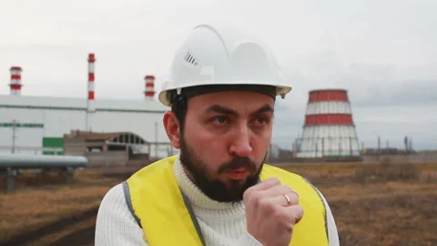 Worker coughing. Engineer at a thermal power plant Stock Footage 142859920