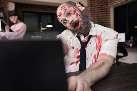 Worker covered in scars exhausted after overwork, capitalism slave concept Stock Photos