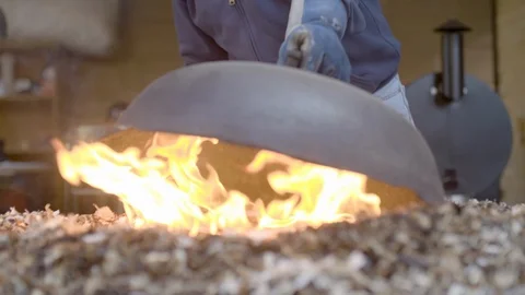Worker covering fire pit with a lid Stock Footage 87614466