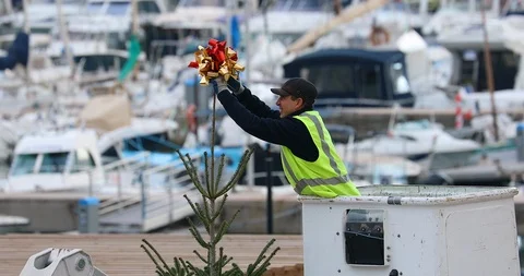 Worker On The Crane Install And Decorate The Christmas Tree Stock Footage 99495491