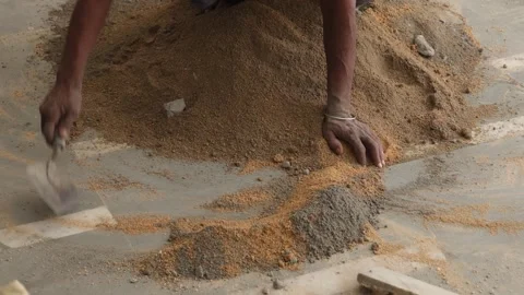 Worker creating the cemented mixture. using cement powder Stock Footage 245101577