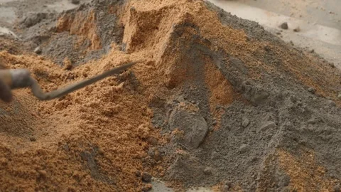 Worker creating the cemented mixture. using cement powder Stock Footage 245101879