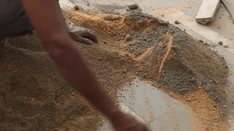 Worker creating the cemented mixture. using cement powder Stock Footage 245101891