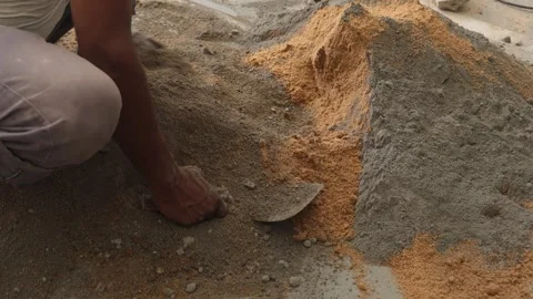 Worker creating the cemented mixture. using cement powder Stock Footage 245101915