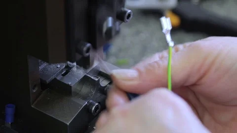 Worker is crimping wire terminals (close-up) Видео 75566416