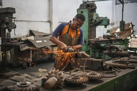 A worker cut the metal Stock Photos