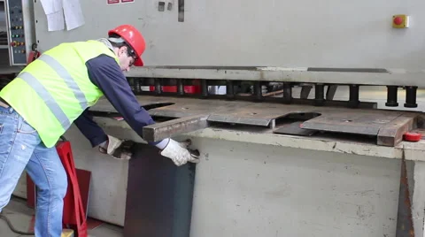 Worker cut metal plate on big machine Stock Footage 66420835
