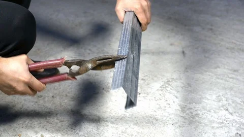 Worker cut with scissors for metal profile Stock Footage 121960396