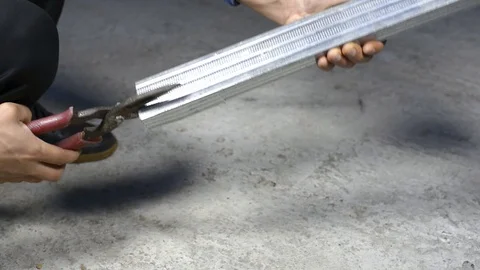 Worker cut with scissors for metal profile Stock Footage 121960410