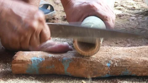 A worker cuts bamboo using a machete Stock-Footage 310125826