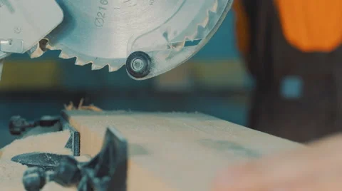 Worker cuts a Board with a circular saw Stock Footage 56317542