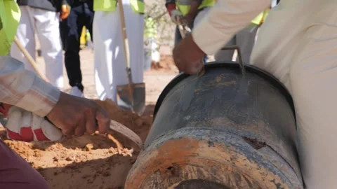 A worker cuts a bucket to plant a tree. Stock Footage 272162184