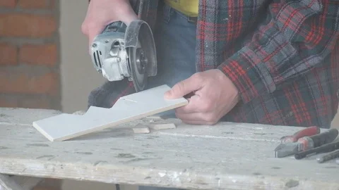 Worker cuts ceramic tiles with an angle grinder. A lot of dust Stock Footage 110606411