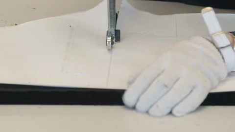Worker cuts fabric by pattern Video stock 118045800