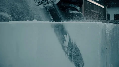Worker cuts ice panel, Christmas cityscapes. Video stock 121940689