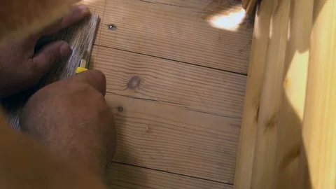 The worker cuts off the linoleum with a utility knife,fitting of linoleum floor Stock Footage 77834527