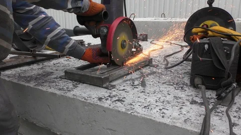 Worker cuts metal with an angle grinder. Stock Footage 116206923