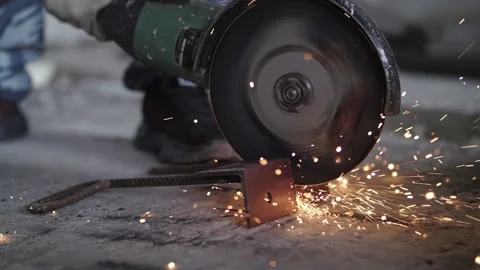 Worker cuts metal with a angle grinder Stock Footage 201382599