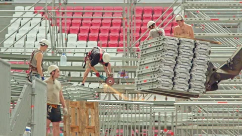 Worker cuts metal beam forklift loader transports materials Stock Footage 237006570
