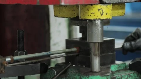 Worker cuts off metal blanks using a machine tool Stock Footage 162914663