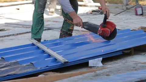 Worker Cuts Metal With Grinder Stock Footage 104300253