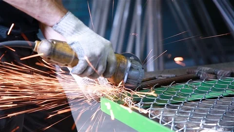 Worker cuts the metal mesh Stock Footage 97730820
