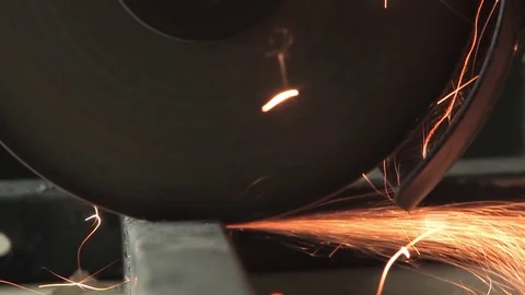 A worker cuts a metal part with a cutting wheel, vulcanite, sparks fly, iron sca Stock Footage 80940654