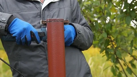 Worker cuts a metal pipe Stock Footage 80051552