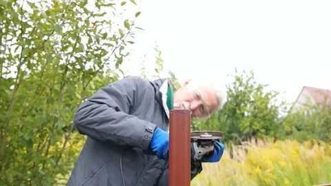 Worker cuts a metal pipe Stock Footage 80088726
