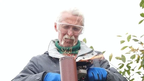 Worker cuts a metal pipe Stock Footage 80088861