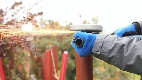 Worker cuts a metal pipe Stock Footage 80109899
