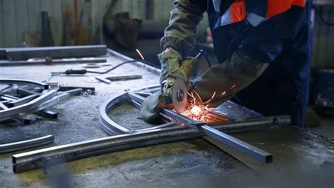 Worker cuts a metal pipe Stock Footage 97812346