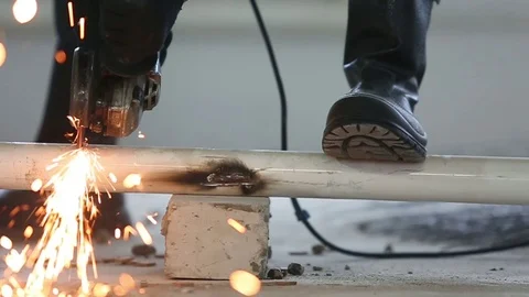Worker cuts a metal pipe grinder removed the slider Video stock 72558323