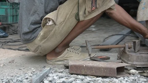 Worker cuts a metal pipe with some electric device or applianc Stock Footage 83787705