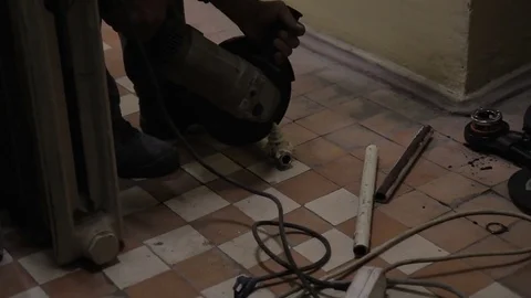 Worker cuts metal pipe using gas equipment at factory. Stock Footage 83111882
