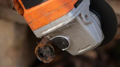 Worker cuts the metal structure with a grinding machine. Stock Footage 95968711