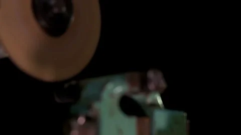 The worker cuts off a piece of metal with a cutting tool Stock Footage