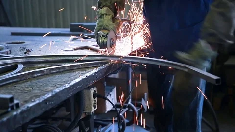 Worker cuts a piece of pipe Stock Footage 97730806